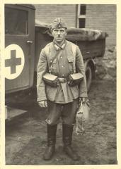 Imagine atasata: Wehrmacht_Man_Posed_by_Medical_Unit_Truck.jpg