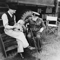 Imagine atasata: Prime Minister Winston Churchill and General Sir Bernard Montgomery & his dog (named Rommel) in Normandy at Montgomery\'s caravan at his headquarters at Chateau Creully, 7 August 1944 (2).jpg